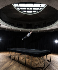 man doing tricks on an Akrobat USA trampoline