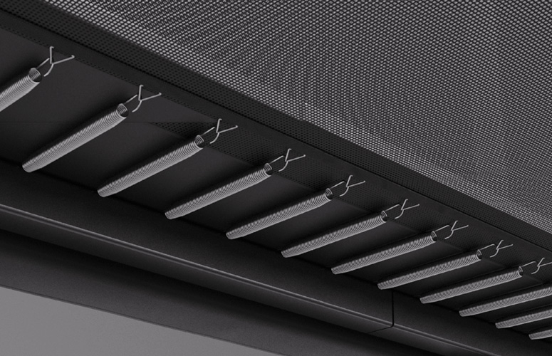 What to Do with a Trampoline in Winter | Take It Down? 4 A black and white image showcasing a textured wall featuring a prominent metal grill design.