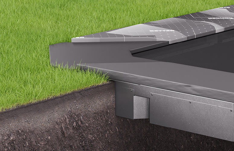 A sturdy metal trampoline placed on a lush green grass area, perfect for recreational activities.