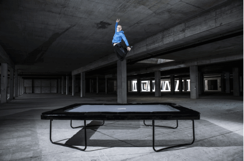 athlete jumping on medium rectangular trampoline